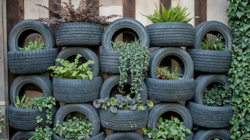 A stack of old tires converted into a vertical garden.