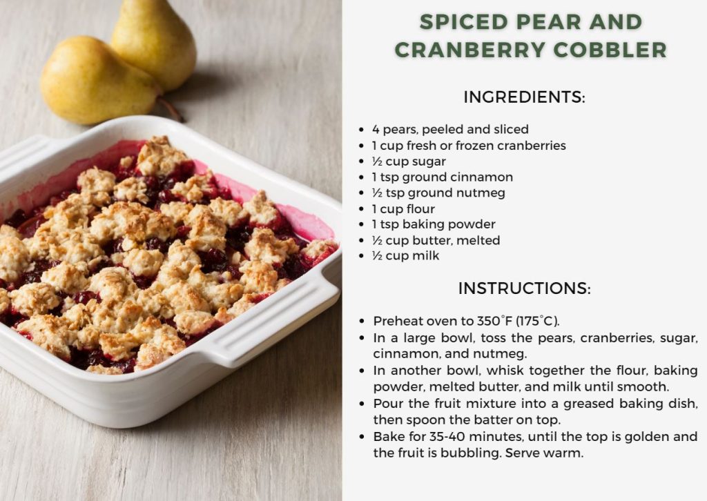 Spiced Pear and Cranberry Cobbler served in a small white dish, 2 pears are served on the side.