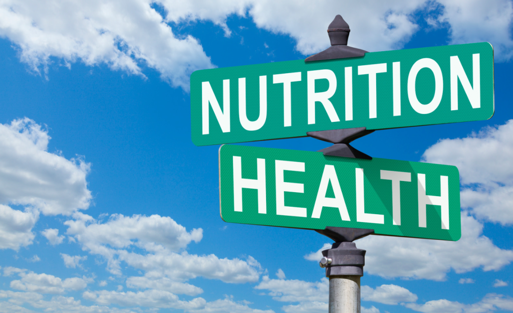 A street sign that reads "nutrition" on top and "health" below.